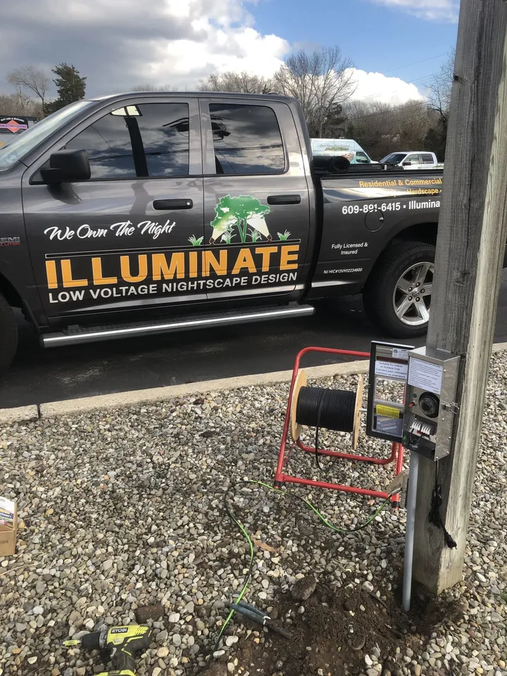 Illuminate Low Voltage Lighting work truck on a job site